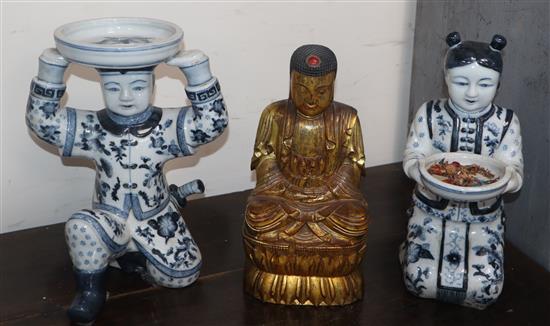 A giltwood Buddha and two porcelain figures